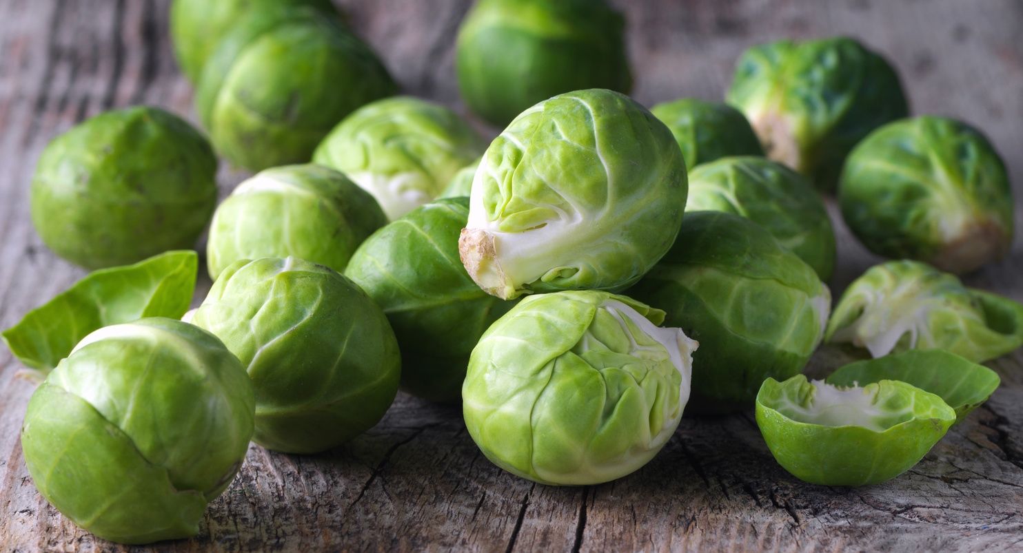 Brussels sprouts cabbage on old wooden table